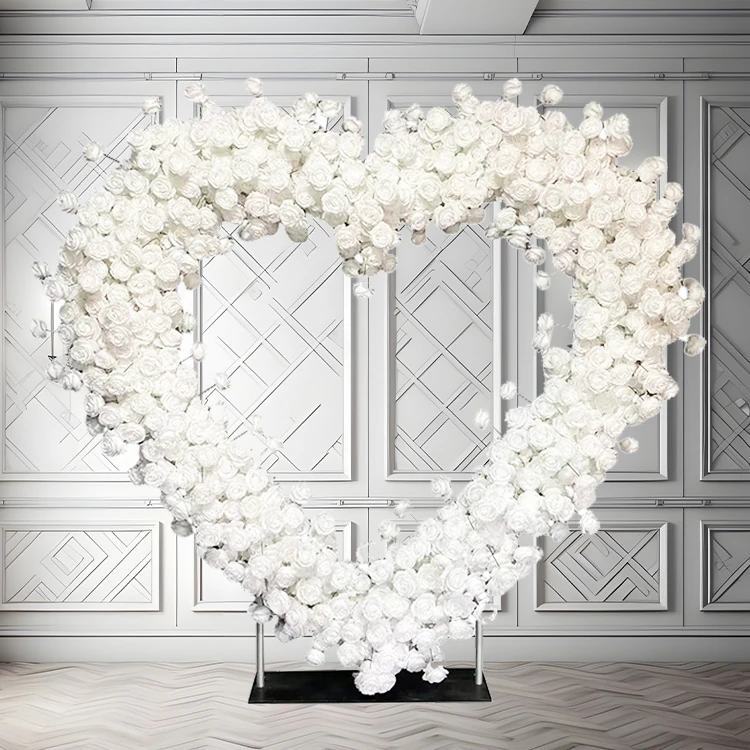 White heart-shaped floral archway set up for a wedding ceremony in New York