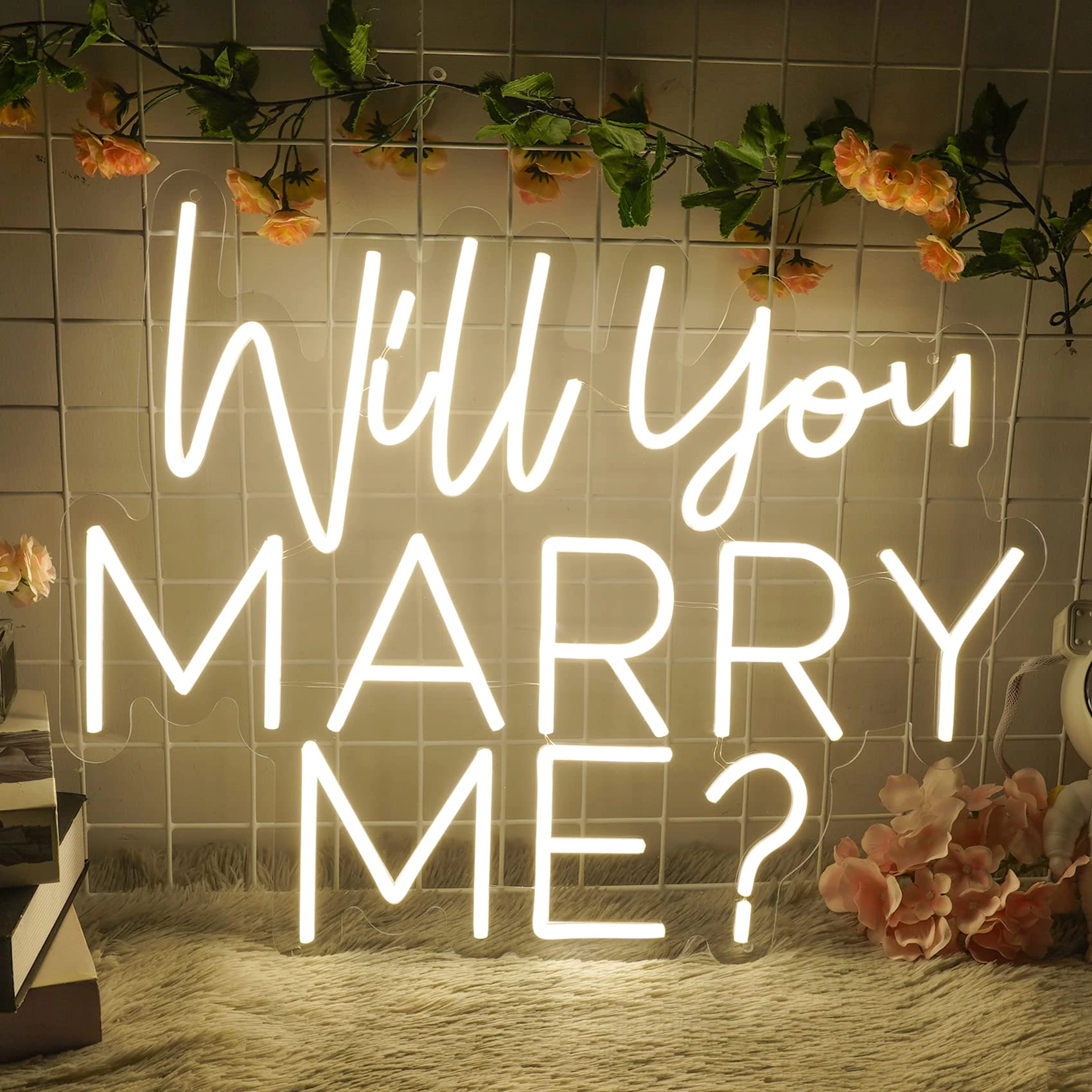 Will You Marry Me neon sign in warm white, used in a New York proposal setup